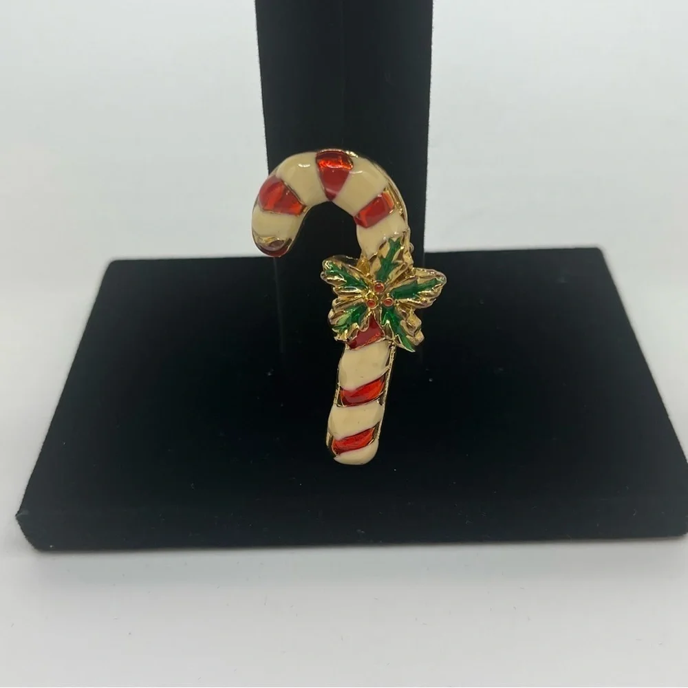Vintage candy cane pin. Costume Jewelry Enamel, red and white green holly.